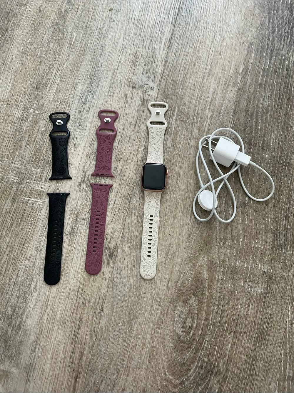 Apple Smartwatch with White, Black, and Mauve Bands